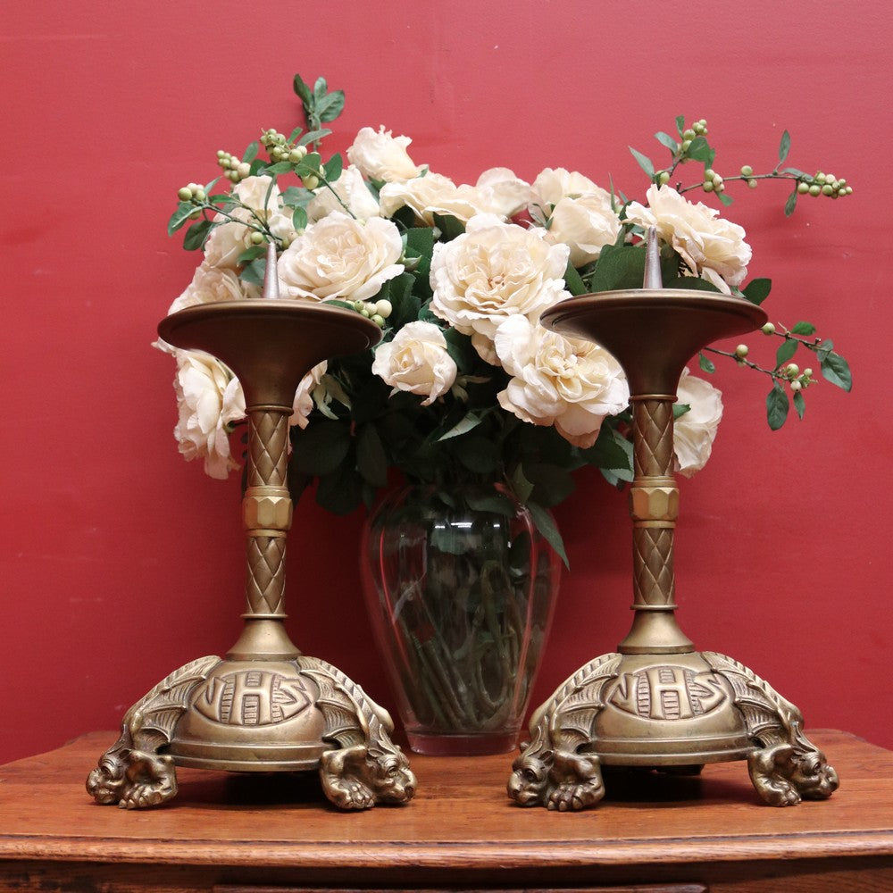 A pair of antique French candlestick holders, brass candle holders, and  gargoyle feet. B11963